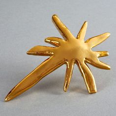 Features: - 100% Authentic CHRISTIAN LACROIX. - Massive gilt resin star brooch. - Gold tone hardware. - Signed Christian Lacroix CL Made in France. - Excellent vintage condition. Measurements: Height: 5.43 inches (13.8 cm) Width: 3.89 inches (9.9 cm) * This brooch will be shipped via DHL Express with tracking number. Please convo me for any queries and additional photos. Thank you for visiting. Other Fees that buyers need to know: Please make sure you know and understand the laws in your country Gold Star Brooches As Gift, Star Brooch, Gold Brooch, Christian Lacroix, Gold Stars, Dhl Express, Holiday Spirit, Vintage Gold, Made In France