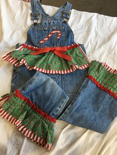 Ugly Christmas overalls denim set covered with holiday images and fabric. red bows, santa fabric and candy canes. these are Old Navy kids overalls that i reworked for a friends daughter.  This has adjustable straps, no holes or the like.  the tag reads:  old Navy Blue Jeans  size 4 Christmas Overalls, Christmas Sweater Dress, Overalls Denim, Old Navy Kids, Kids Overalls, Overalls Outfit, Holiday Images, Altered Couture