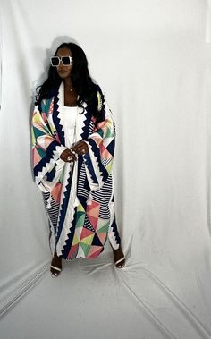 Rich Auntie at it's finest! Our fashion satin kimono can be worn as an oversized dress on it's own or cinched at the waist for a more fitted look. Flowy and colorful style definitely can make this a beach coverup or vacation look. In One Size fits most as the sleeves are open flowy and the kimonos have an open front. Size US Size One Size Chic Multicolor Spring Kaftan, Chic White Kimono For Beach Cover-up, Chic White Kimono For Loungewear, White Long Robe For Spring, Long White Robe For Spring, Chic White Open Front Kimono, White Open Front Kaftan, Multicolor Fall Vacation Kaftan, White Free Size Kimono With Kimono Sleeves