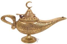 an ornate brass teapot with a crescent on top