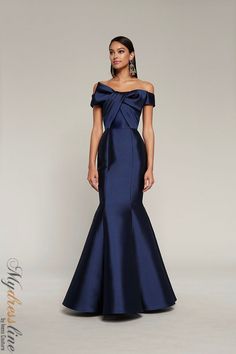 Looking for a show-stopping dress for your next special occasion? Check out the Frascara 4010 Off the shoulder gown. This gorgeous dress features a draped bodice with bow detail, and a mermaid silhouette that is sure to turn heads. It also has a hidden back zipper and is satin lined for a luxurious feel. Made from 51% silk and 49% wool, this dress is sure to make you feel like a million bucks! Luxury Sleek Silk Dress For Gala, Ceremony Dress, Couture Evening Dress, Draped Bodice, Looks Country, Maid Of Honour Dresses, Couture Looks, Satin Evening Dresses, Black Tie Gala