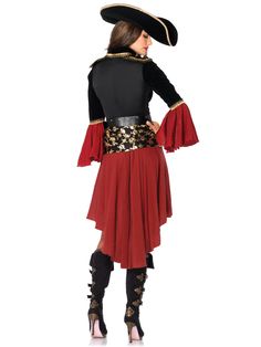 a woman wearing a pirate costume with red skirt and black top, standing in front of a