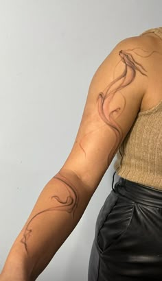 a woman with a tattoo on her arm