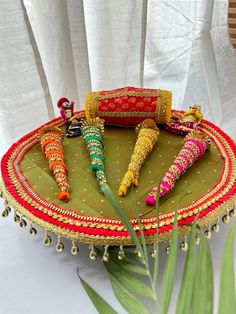 a decorative tray with some colorful items on it