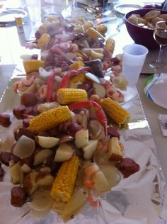 the food is prepared and ready to be eaten on the long serving platter with utensils