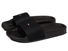 Tommy Hilfiger Roldez - Men's Shoes : Black : The Tommy Hilfiger Roldez slides offers a sleek and stylish look. Man-made upper. Man-made lining and insole. Slide-on construction. Brand logo on the strap girth. Man-made outsole. Imported. Measurements: Weight: 6 oz Product measurements were taken using size 10, width D - Medium. Please note that measurements may vary by size. Weight of footwear is based on a single item, not a pair. Classic Black Slides With Textured Footbed, Classic Slides With Rubber Sole, Classic Flat Slides With Removable Insole, Classic Slip-on Slides With Removable Insole, Classic Black Slides With Branded Insole, Classic Open Toe Slides With Textured Sole, Classic Black Slip-on Slides, Classic Synthetic Slides, Classic Black Slides With Rubber Sole