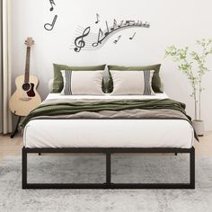 a bedroom with a bed, guitar and musical notes on the wall