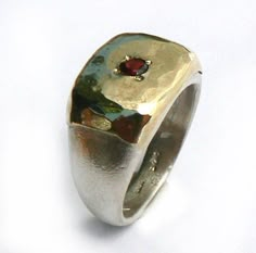 A pinky ring made of sterling silver and 10k yellow gold sheet soldered on top, hammered and set with Garnet. This ring can fit other fingers as well. You can choose the gemstone from this list: red garnet / cz / turquoise / blue topaz / sapphire / peridot / pearl / amethyst. Measurments: Width: 0.43 inch x 0.59 inch / 11 mm x 15 mm Thickness:0.11 inch / 3 mm This listing is for sizes 3.5-8 For other sizes - please convo me. Additional information If you liked this item, you may also want to loo Lost Wax Jewelry, Rectangular Ring, Pearl Amethyst, Big Stone Ring, Dope Jewelry, Classy Jewelry, January Birthstone, Funky Jewelry, Jewelry Lookbook