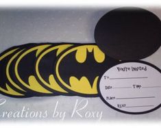 a batman themed birthday party with yellow and black decorations on the front, white envelopes in the back