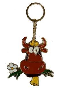 a cow keychain with a flower in it's mouth and eyes, on a white background