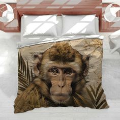 a bed with a monkey on it's head and palm leaves in the background