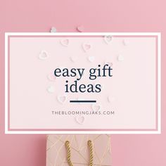 a gift bag with the words easy gift ideas on it next to some paper hearts