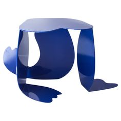 the blue table is shaped like an abstract piece