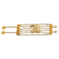 The Chanel Gold Plated CC & Button Detail 6-Strand Pearl Bracelet is a luxurious accessory that epitomizes timeless elegance. This exquisite piece features six strands of lustrous pearls elegantly connected into a cohesive bracket, creating a stunning visual effect that is both opulent and sophisticated. A signature gold-plated CC logo sits prominently at the center, enhancing the bracelet's allure. Adorned with charming gold-plated button motif charms, this piece marries classic Chanel design elements with modern flair, making it a perfect addition to any jewelry collection. The adjustable chain allows for a customizable fit, ensuring comfort without compromising style. Pair this bracelet with other designer items like a classic Gucci Marmont bag, a Louis Vuitton scarf, or a statement Dio Luxury Adjustable Pearl Bracelet For Formal Occasions, Luxury Gold Bracelets With Channel Set, Luxury Yellow Gold Pearl Chain Bracelet, Luxury Yellow Gold Plated Pearl Bracelet, Luxury Yellow Gold Pearl Charm Bracelet, Vintage Chanel Bracelet, Gucci Marmont Bag, Louis Vuitton Scarf, Gucci Marmont