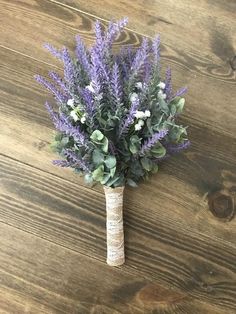 a bouquet of lavender flowers on a wooden table