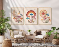 three paintings hang on the wall next to two chairs and a potted plant in front of them