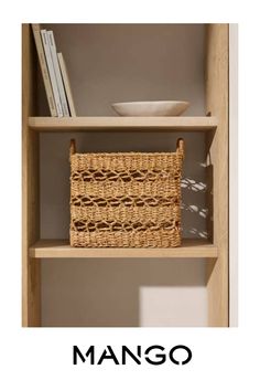 a book shelf with a basket on top of it