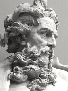 a statue of a man with long hair and beard