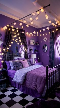 a bedroom decorated in purple and black with stars on the ceiling, bedding and curtains