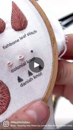 someone is stitching something with their hand and the needle has four different stitches on it