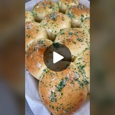 a video demonstrating how to make garlic bread rolls with cheese and parsley on top