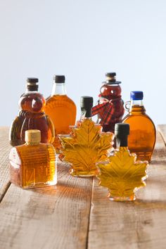 maple syrup bottles are lined up on a table