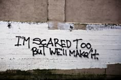 graffiti on the side of a building that says i'm scared to bat we'll make it