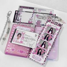 an assortment of pink and white scrapbook pages with photos attached to them, including a key chain