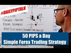 a man standing in front of a whiteboard with the words 50 pips a day