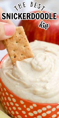 a person dipping some crackers into an apple dip