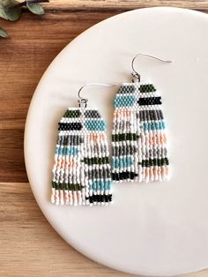 These fun, playful, and unique earrings have a bright and gorgeous color palette! You'll definitely make a statement with these! Ear wires are silver plated and hypoallergenic. **Each of my earrings are delicately handwoven bead by bead. I absolutely love making these and want you to know that each piece is made with patience and care from start to finish! These earrings are made with size 11/0 Delica Japanese Miyuki seed beads. I use strong nylon thread to ensure the integrity of each earring.* Seed Bead Jewelry Patterns, Bead Earring, Delica Beads, Fall Jewelry, Bead Jewelry, Seed Bead Earrings, Brick Stitch, Seed Bead Jewelry, Fringe Earrings