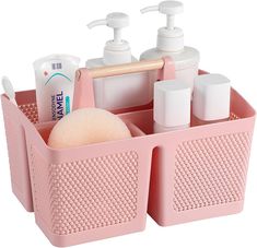 a pink plastic container with soap, lotion and hand sanitizers in it