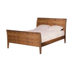 a wooden bed frame with white sheets and pillows