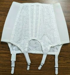 Up for sale is this vintage Cool-ette open bottom girdle produced by Crown Foundations. It has a 100% cotton body with elastic side sections. The cotton body features an embroidered, leaf design with cutouts. Has a hook and eye closure. The style number is 4730 and it is tagged as size 27. It is in great condition, almost appearing as NWOT.  Measures about 12 1/4" across the waist when not stretched.  Measures about 11 3/4" from waist to hem down middle As always, thank you for your interest. Go Half Corset, Full Corset, Body Corset, Girdles Shapewear, Vintage Girdle, Embroidered Leaf, Garter Belts, Body Features, Vintage Crown