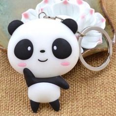 a key chain with a panda bear on it