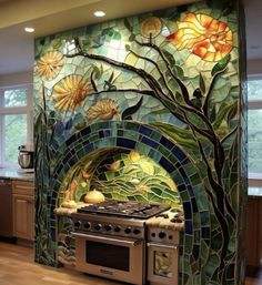 a kitchen with an oven, stove and counter top covered in colorful tile work on the wall