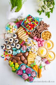 a table topped with lots of different types of candies and other foods on top of it