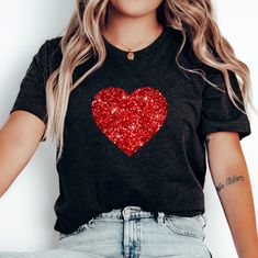 Faux Glitter Heart Shirt, Womens Cute Valentine TShirt, Sparkly Heart Graphic Tee, Women Red Heart Valentine Shirt, Valentine Gift for Her Want the 'Glitter Heart' Sweatshirt instead?  Click here:  https://www.etsy.com/listing/1630294456/ This cute valentines shirt is sure to make a statement!  The best part is that it's not real glitter but is a printed image so it's not messy. ---HOW TO ORDER--- 1 ) Please, check and review all photos for important ordering information 2 ) Choose your t-shirt Trendy Crew Neck Top For Valentine's Day, Trendy Red T-shirt For Party, Trendy Red Top With Heart Print, Red Crew Neck Top With Heart Patch, Cute Red Party Top, Heart-shaped Graphic Print Tops For Valentine's Day, Red Heart Graphic Top For Valentine's Day, Casual Red Tops For Valentine's Day, Red Casual Party T-shirt