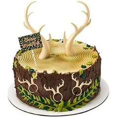 a cake decorated with deer antlers and leaves