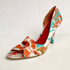 Beautiful Open Toe Heels With Partial Side Opening And Tie Detail In The Front Colors Of Teal, Organs, Pink, Blue And Green Over A White Base Heel Height: 4” New Never Worn 93 Spring Multicolor Heels, Multicolor Floral Print Heels With Round Toe, Multicolor Floral Print Heels For Spring, White Retro Heels For Summer, Multicolor Heels For Spring Formal Events, Multicolor Heels For Formal Summer Occasions, White Retro Summer Heels, White Fabric Open Toe Heels, Multicolor Formal Heels For Summer