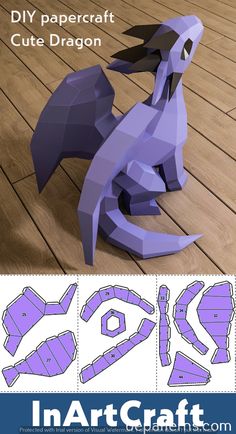 papercraft cut out dragon sitting on the floor with instructions for how to make it