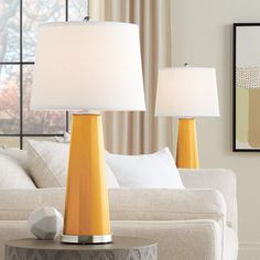 a living room scene with focus on the table lamp and the lampshade in the background