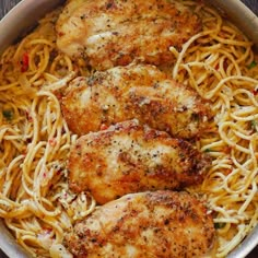 some chicken and noodles in a pan on a table