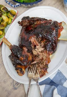 a white plate topped with meat and vegetables