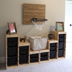 a basketball hoop mounted to the side of a wall next to bins and baskets