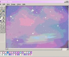 a computer screen with an image of the sky and stars on it's side