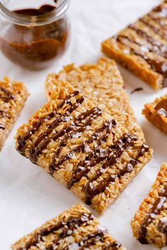 homemade granola bars with chocolate drizzled on top