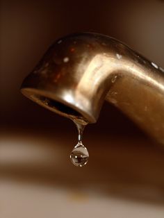 a faucet with water dripping from it