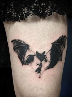 a black and white photo of a bat on the thigh