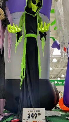 an inflatable halloween decoration with green and purple decorations